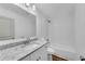 Bathroom featuring a granite countertop, white cabinets, and tiled shower at 4770 Wayland Cir, Acworth, GA 30101