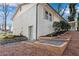 Brick home exterior showcasing landscaped terraced yard and convenient basement access at 4770 Wayland Cir, Acworth, GA 30101