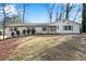 Well-maintained home exterior featuring a lush green lawn and mature landscaping at 4770 Wayland Cir, Acworth, GA 30101