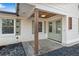 Inviting front porch with stylish wood accents, chic rain chains, and fresh neutral paint at 4770 Wayland Cir, Acworth, GA 30101