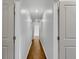 Hallway with hardwood floors and neutral wall paint at 4770 Wayland Cir, Acworth, GA 30101