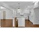 Bright white kitchen with stainless steel appliances and a granite-topped island at 4770 Wayland Cir, Acworth, GA 30101