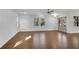 Living room featuring hardwood floors, neutral paint, modern ceiling fan, and lots of natural light at 4770 Wayland Cir, Acworth, GA 30101