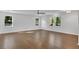 Large living room featuring hardwood floors, natural light, and fresh neutral paint at 4770 Wayland Cir, Acworth, GA 30101