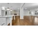 Open-concept living space with a brick fireplace and hardwood floors at 4770 Wayland Cir, Acworth, GA 30101