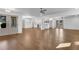 Open-concept living space with wood floors, neutral paint, modern lighting, and exterior doors at 4770 Wayland Cir, Acworth, GA 30101