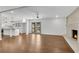 Open-concept living space with hardwood floors, neutral paint, fireplace, and plenty of natural light at 4770 Wayland Cir, Acworth, GA 30101
