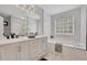 Bright bathroom with large vanity, soaking tub, and elegant finishes at 10 Oakbrook Ln, Covington, GA 30016