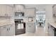 Well-lit kitchen featuring granite countertops, stainless steel appliances, and a stylish backsplash at 10 Oakbrook Ln, Covington, GA 30016