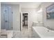 Bright bathroom with a soaking tub, vanity and glass enclosed shower at 11 Ganel Ln, Alpharetta, GA 30009