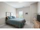 Comfortable bedroom features a plush bed, natural light from the window, and minimalist decor at 11 Ganel Ln, Alpharetta, GA 30009