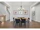 Bright dining room with a chandelier, hardwood floors and modern decor at 11 Ganel Ln, Alpharetta, GA 30009