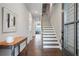 Welcoming foyer with hardwood floors, staircase, and ample natural light at 11 Ganel Ln, Alpharetta, GA 30009