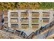 Overhead view of a large garden with multiple raised beds and a gravel path at 11 Ganel Ln, Alpharetta, GA 30009