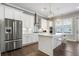 Modern kitchen with stainless steel appliances, quartz countertops, and a stylish island at 11 Ganel Ln, Alpharetta, GA 30009