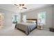 Spacious main bedroom with ceiling fan, neutral carpet and ensuite access at 11 Ganel Ln, Alpharetta, GA 30009