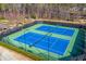 Well-maintained blue tennis courts are ready for play in this active community at 11 Ganel Ln, Alpharetta, GA 30009