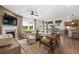 Open living room featuring a fireplace, large windows, and hardwood flooring at 1639 Tide Mill Rd, Cumming, GA 30040