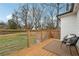 Relaxing backyard deck with modern railing and comfortable seating overlooking a fenced yard at 176 Rhodesia Se Ave, Atlanta, GA 30315