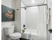 Clean bathroom with white subway tile, shower-tub combination, white toilet, and stylish decor at 176 Rhodesia Se Ave, Atlanta, GA 30315