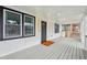 Charming front porch with modern black accents, stylish lighting, and fresh paint at 176 Rhodesia Se Ave, Atlanta, GA 30315