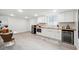 Modern in-law suite kitchen with white cabinets, stainless steel appliances, and butcher block countertops at 176 Rhodesia Se Ave, Atlanta, GA 30315