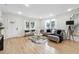 Well-lit living room showcasing hardwood floors, stylish furniture, and modern decor at 176 Rhodesia Se Ave, Atlanta, GA 30315