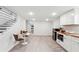 Finished basement living area with kitchenette featuring white cabinets and butcher block countertops at 176 Rhodesia Se Ave, Atlanta, GA 30315