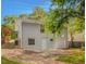 Back of the home featuring a garage and fenced in yard at 1857 Dunlap Ave, East Point, GA 30344