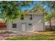 Back exterior view of home featuring private entrance, single-car garage, and level backyard at 1857 Dunlap Ave, East Point, GA 30344