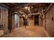 Unfinished basement features cement floors and exposed ceiling with ductwork at 1857 Dunlap Ave, East Point, GA 30344