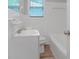 Bathroom features a bathtub, updated fixtures, and tile surround at 1857 Dunlap Ave, East Point, GA 30344