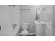 Compact, bright bathroom featuring a modern toilet, vanity, and shower/tub combo at 1857 Dunlap Ave, East Point, GA 30344