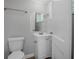 Cozy bathroom with sink, mirror, and toilet at 1857 Dunlap Ave, East Point, GA 30344