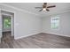 Spacious bedroom with ceiling fan, new floors, and windows at 1857 Dunlap Ave, East Point, GA 30344