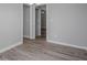 Bedroom view highlighting the modern flooring, neutral walls, and connecting doorways at 1857 Dunlap Ave, East Point, GA 30344