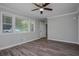 Modern bedroom featuring hardwood floors, crown molding, and ceiling fan at 1857 Dunlap Ave, East Point, GA 30344