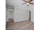 Clean, well-lit bedroom features new floors and neutral paint at 1857 Dunlap Ave, East Point, GA 30344