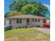 Front exterior of the house featuring a lawn and a small porch at 1857 Dunlap Ave, East Point, GA 30344