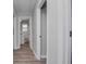 Hallway with bathroom featuring modern gray walls and wood-look flooring at 1857 Dunlap Ave, East Point, GA 30344