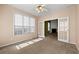 Cozy bedroom with large windows and french doors leading to a living area with a fireplace at 3296 Quincey Xing, Conyers, GA 30013