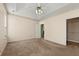 Bedroom with neutral carpet, a tray ceiling and access to a closet at 3296 Quincey Xing, Conyers, GA 30013