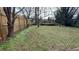 Open backyard space with grassy area and partial fencing at 4027 Gladesworth Ln, Decatur, GA 30035