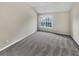 A vacant, carpeted bedroom with a window that provides natural lighting at 1394 Orchard Park Dr, Stone Mountain, GA 30083