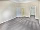 Spacious carpeted bedroom featuring a walk-in closet and adjacent bathroom at 1394 Orchard Park Dr, Stone Mountain, GA 30083