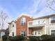 Inviting condo with brick accents and a private balcony offers a charming exterior appeal at 1394 Orchard Park Dr, Stone Mountain, GA 30083
