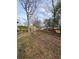 This picture shows a vacant lot surrounded by trees and neighborhood at 1413 Lanier Ne Pl, Atlanta, GA 30306