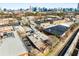 An aerial view shows the property in an urban setting with surrounding buildings and cityscape at 500 Means Nw St # F, Atlanta, GA 30318