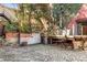 An exterior backyard view with brick and stone features, and a small deck with a seating area at 500 Means Nw St # F, Atlanta, GA 30318