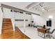 Finished basement offers a staircase to upstairs, great lighting, and exercise equipment at 500 Means Nw St # F, Atlanta, GA 30318